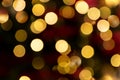 Golden glowing bokeh background. Abstract bright led light backgdrop. Defocused image Royalty Free Stock Photo