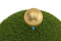 A golden golf ball on tee in grass isolated on white background. Royalty Free Stock Photo