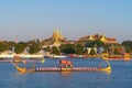 The Golden Grand Palace with the royal barge procession for The Thai King on Chao Phraya River near Downtown of Bangkok City,