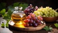 Golden grape oil in a glass jug, surrounded by fresh grapes on a wooden board, illuminated by warm light