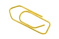 Golden grounge paper clip isolated on white background close up Royalty Free Stock Photo