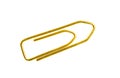 Golden grounge paper clip isolated on white background close up Royalty Free Stock Photo