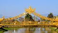 Golden Hall of Ganesha with small bridge, ornate arch with tourist in face mask