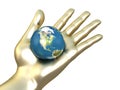 Golden hand with earth