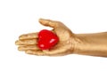 Golden hand with a red heart Royalty Free Stock Photo