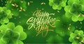 Golden handwriting lettering Happy Saint Patricks Day on green background made of realistic clover leaves and golden