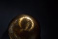 Golden hang drum half on a black background, top view,