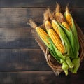 A golden harvest isolated corn on a textured wooden background