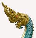 Golden head and green body of formidable naga sculpture