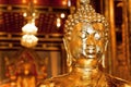 Golden head of meditating Buddha inside the historical Thai temple Royalty Free Stock Photo