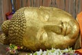 Golden Head of Reclining Buddha Statue on the side of  Parinirvana Temple in Kushinagar Royalty Free Stock Photo