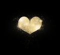 Golden heart on black background