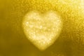 Golden heart bokeh frame on a gold background with space for your valentine wording concept Royalty Free Stock Photo