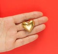Golden heart brooch on hand. Heart shape vintage jewelry. Happy valentines day. Beauty and jewelry concept. Gift for Valentines Royalty Free Stock Photo