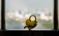 Golden heart shaped love padlock and key over on Stainless steel balcony railing Royalty Free Stock Photo