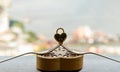 Golden heart shaped love padlock over two intertwined gold forks on Gold heart-shaped box Royalty Free Stock Photo