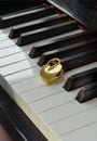 Golden heart shaped love padlock on Piano keyboard. Melody of Love Royalty Free Stock Photo