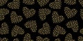 Golden hearts on black background seamless pattern vector illustration. Luxurious elegant pattern