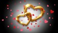 Golden hearts interlocking - isolated on white background Royalty Free Stock Photo