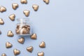 Golden hearts near and inside the bottle. Concept of alms, charity, fundraising, donation. Copy space
