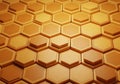 Golden hexagonal tiles create a repeating 3D pattern, reminiscent of a honeycomb Royalty Free Stock Photo