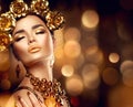 Golden holiday makeup. Fashion art hairstyle, manicure and makeup