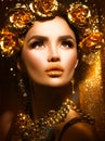 Golden holiday makeup. Golden wreath and necklace