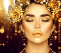 Golden holiday makeup. Golden wreath and necklace