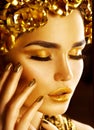 Golden holiday makeup. Golden wreath and necklace