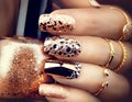 Golden holiday style bright manicure with gems and sparkles Royalty Free Stock Photo