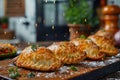 Golden Homemade Empanadas on Wooden Board with Sparkling Festive Background