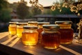 Golden honey jars grace wooden table in great outdoors a nature inspired tableau