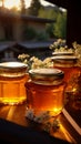 Golden honey jars grace wooden table in great outdoors a nature inspired tableau