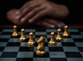 Golden horse, knight chess piece and gold pawn chess pieces on chessboard with businessman on dark background. Leadership, Royalty Free Stock Photo