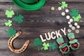 Horseshoe with clover leafs, coins, hat Royalty Free Stock Photo