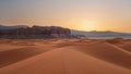 Golden Hour at Abstract Desert Sand Dunes and Rocky Formations in Soft Light. Royalty Free Stock Photo