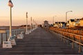 Golden hour on the boardwalk on the New Jersey shore Royalty Free Stock Photo