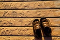 Golden Hour Footprints and Sandals on Michigan Boardwalk Top View Royalty Free Stock Photo