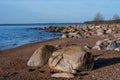 Golden Hour Glow: Rocky Shores of Veczemju Klintis Royalty Free Stock Photo