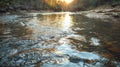 Golden hour lights up a crystal river, mirroring sky in serene wilderness Royalty Free Stock Photo