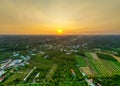 Golden Hour Magic: Breathtaking Sunset Over Tien Giang Province Fields with Serene River and Cityscape in Vietnam Royalty Free Stock Photo