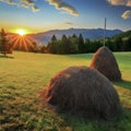 Golden Hour Over Rural Farmland With Haystacks and Mountain Backdrop in Autumn Royalty Free Stock Photo