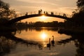 Two swans at the lake while people watch the sunset, Ibirapuera Park, Sao Paulo, Brazil