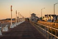 Golden hour sunrise on the jersey shore boardwalk Royalty Free Stock Photo