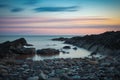 Golden hour sunset at low tide at Duck Pond Beach. Long exposure. Royalty Free Stock Photo