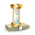 Golden hourglass on money stack