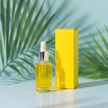 Golden serum bottle silver dropper yellow box tropical leaves image Royalty Free Stock Photo