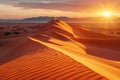 The golden hues of sunset cast over the smooth undulating sand dunes of the Sahara Desert with distant mountains silhouetted Royalty Free Stock Photo