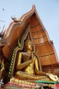 Golden huge Buddha statue is located on the top of the mountain in Thailand