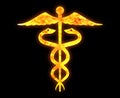 Golden icon of the caduceus pharmacy medical symbol isolated on a black background Royalty Free Stock Photo